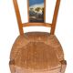 Pair of chairs with barrette backs and bands painted with animated landscapes