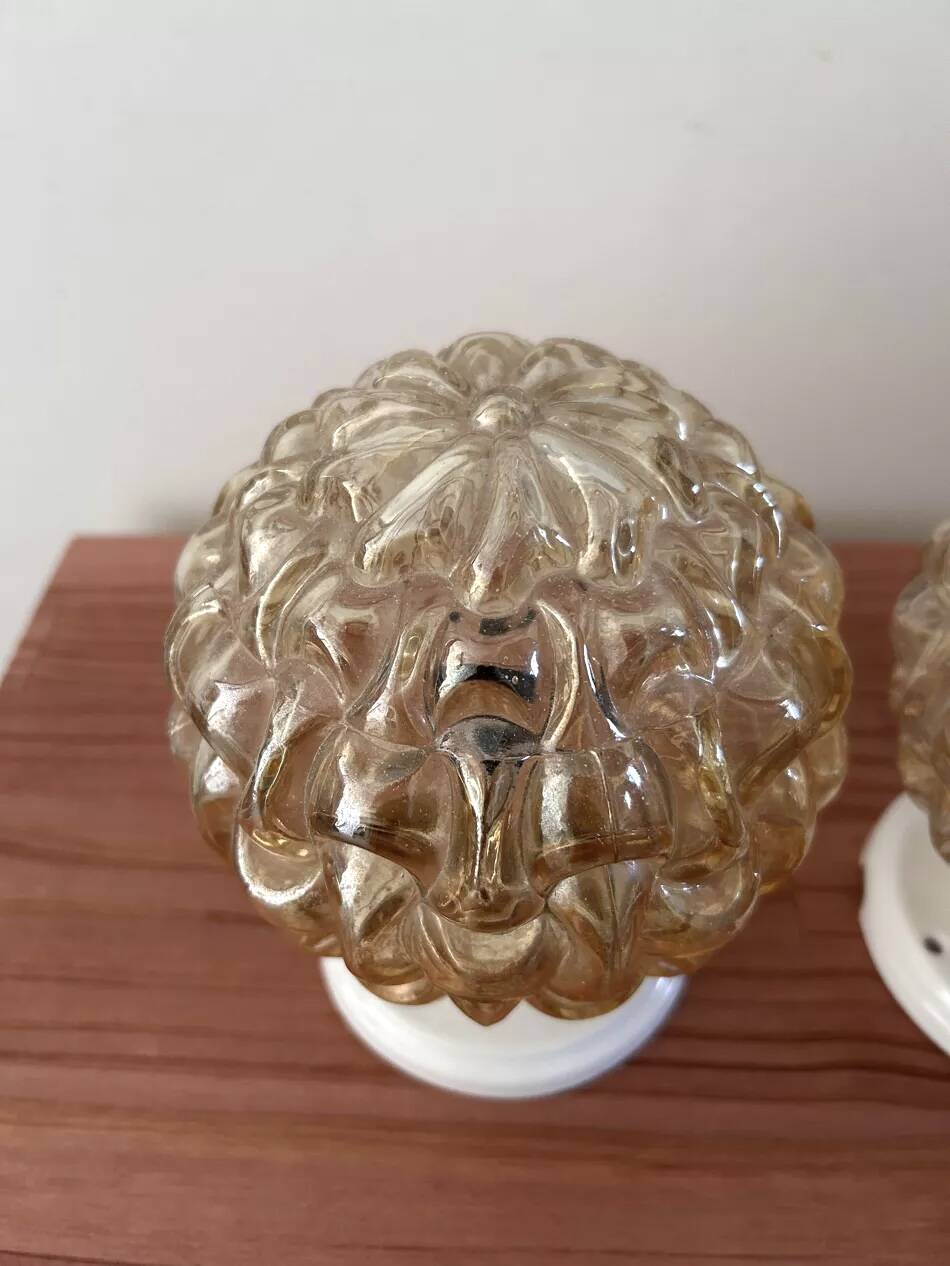 Pair of gold glass globe wall lights