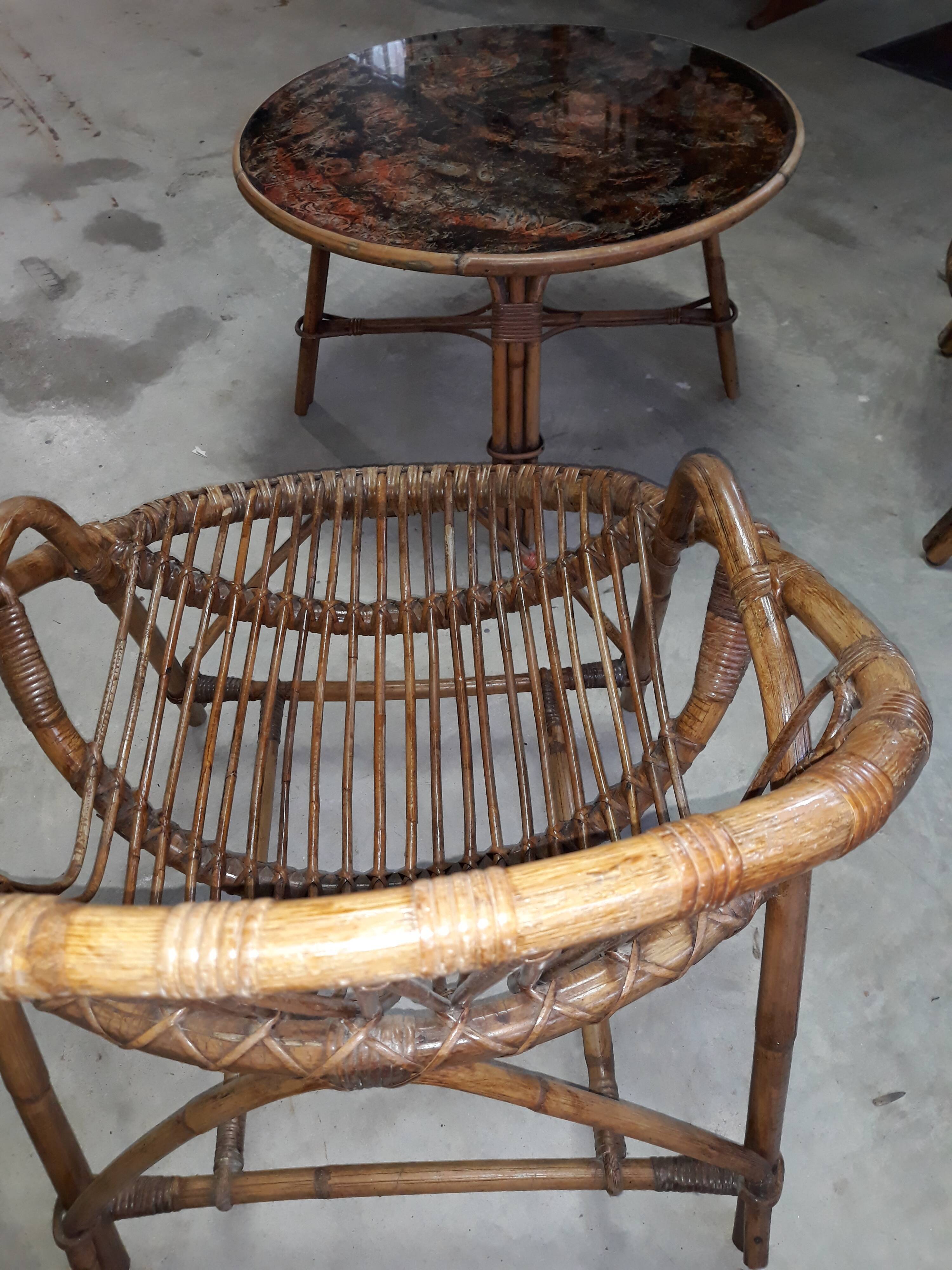 Pair of rattan armchairs and table