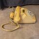 Old dial telephone from the 80s temat quimper bakelite yellow and beige
