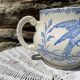 Earthenware pitcher decorated with birds.