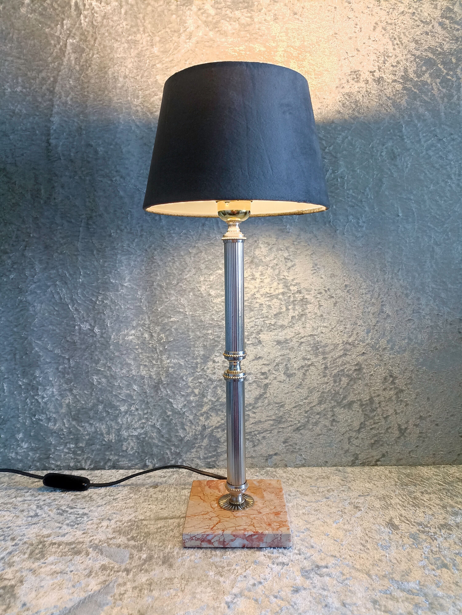 Golden metal lamp with pink marble base