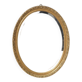 Beveled oval mirror and gilded wood frame