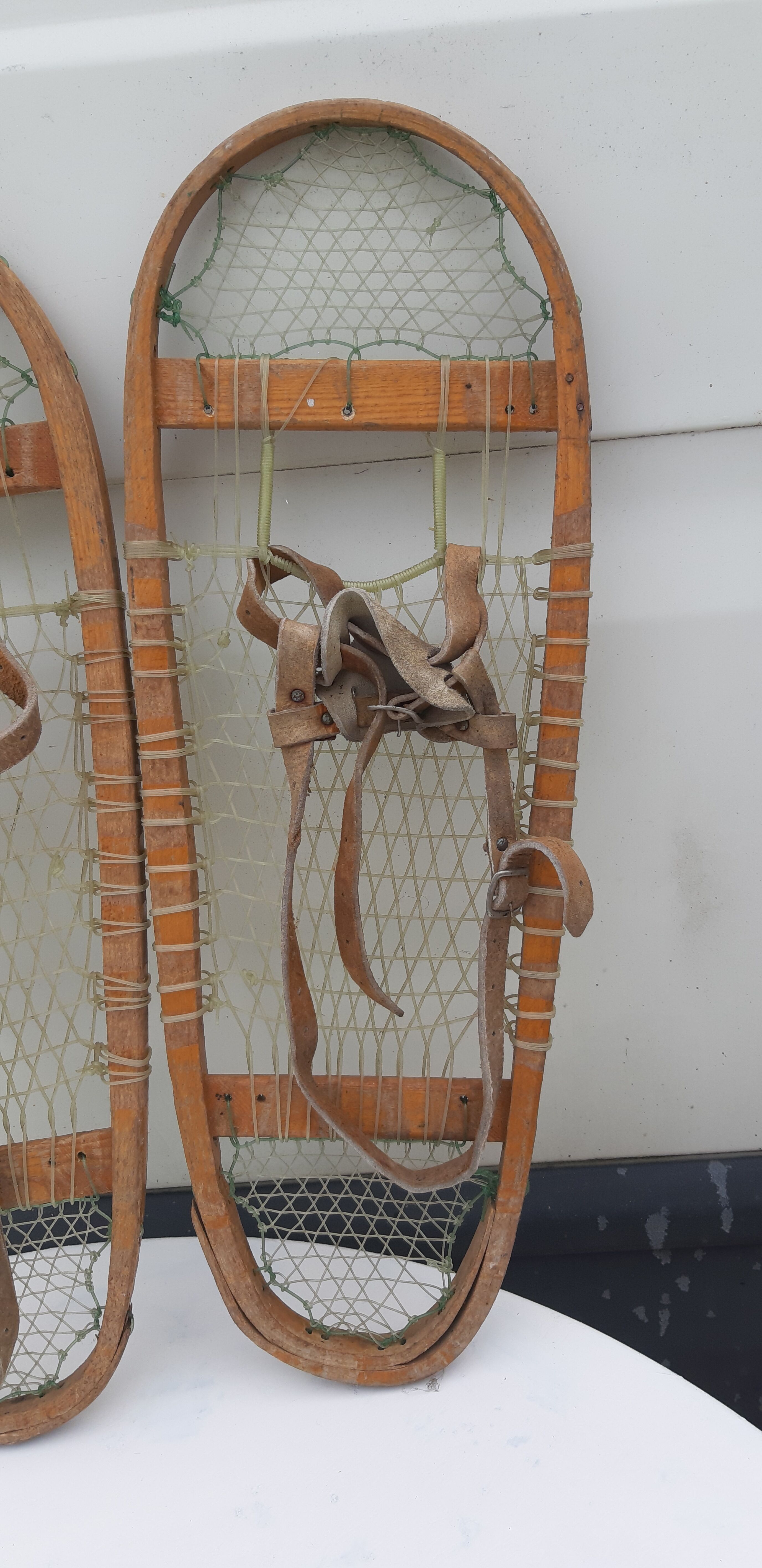 Old snowshoes made of wood and hoses