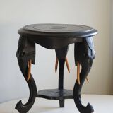 Side table in hardwood ebony with three elephant head-shaped legs, Eastern India, 1920s.