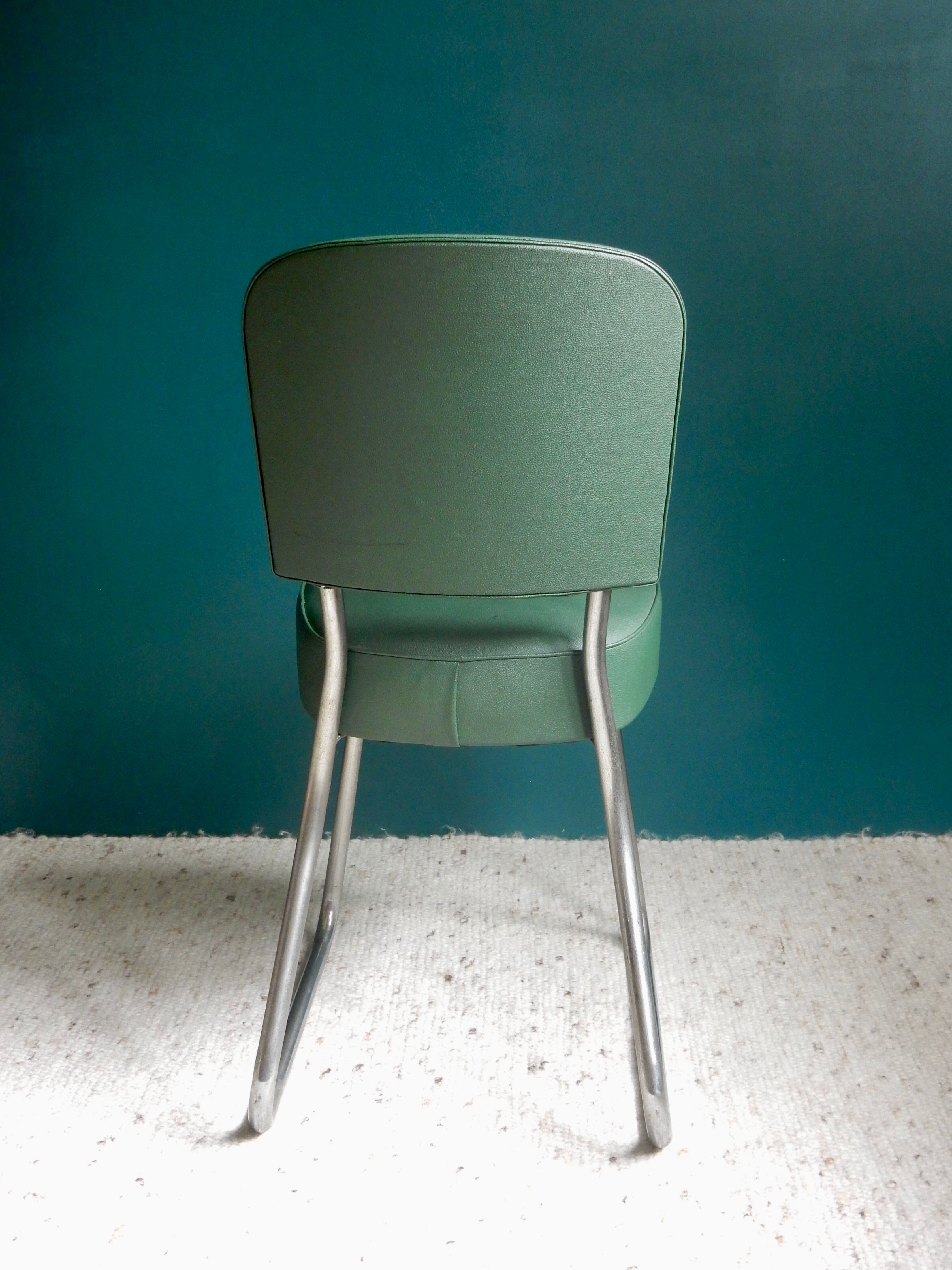 Office chair in green skaï