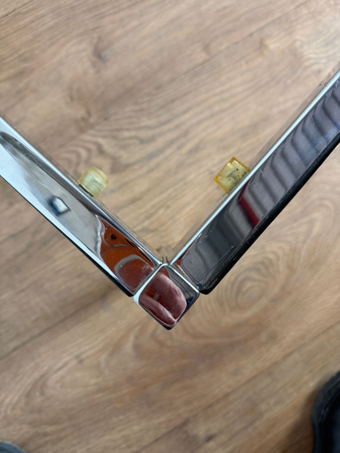 Large designer coffee table from the 70s in chrome, smoked glass, and faux leather.