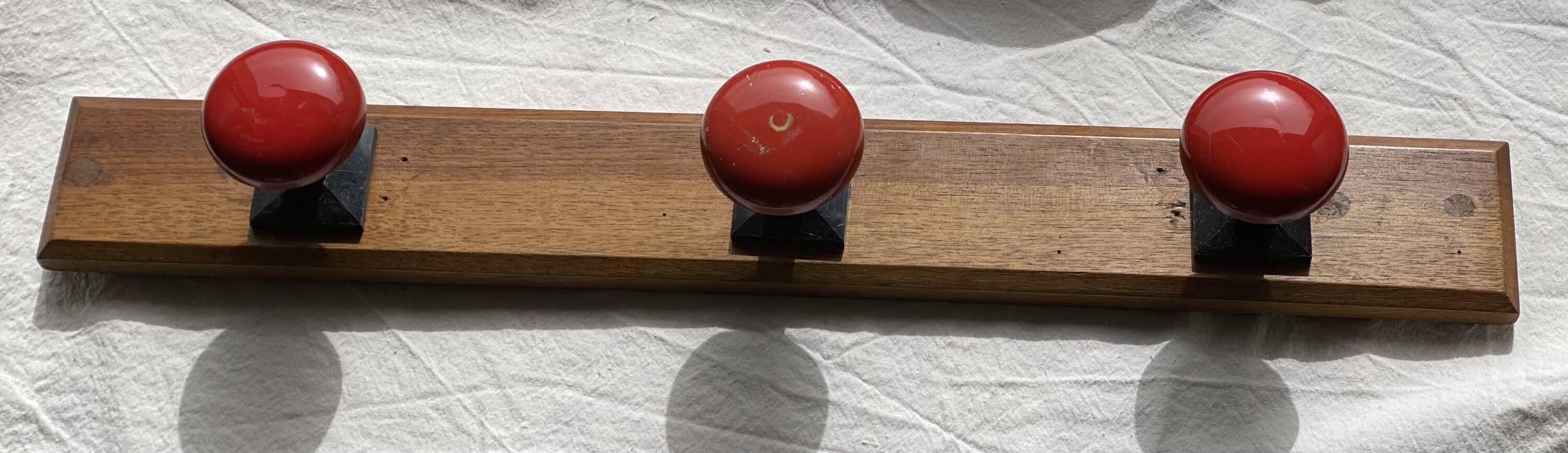 Wall-mounted coat rack with 3 hooks, vintage 1960s red lacquered metal.