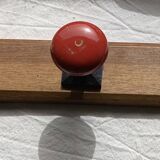 Wall-mounted coat rack with 3 hooks, vintage 1960s red lacquered metal.