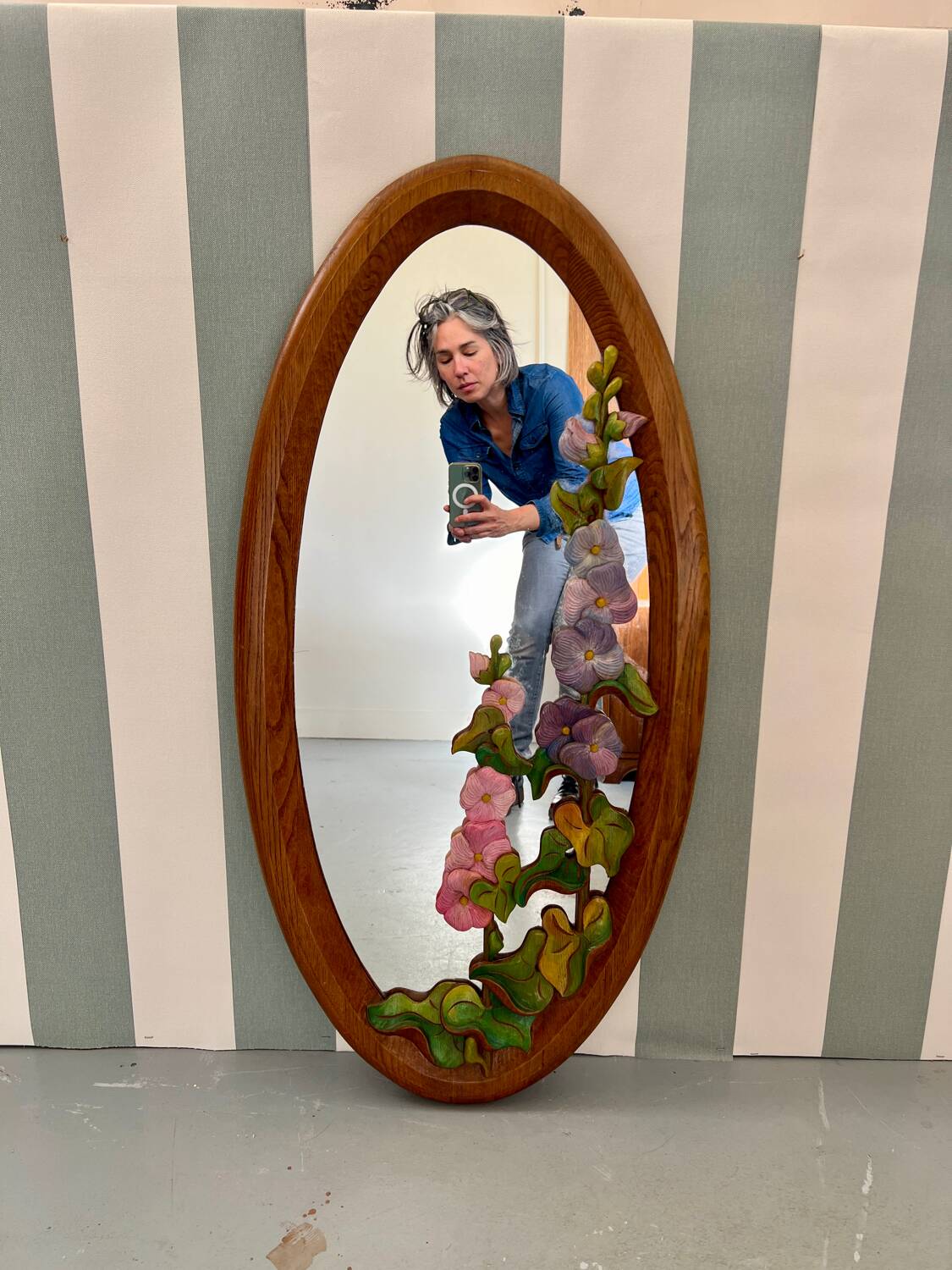 Carved wooden mirror with flower decorations