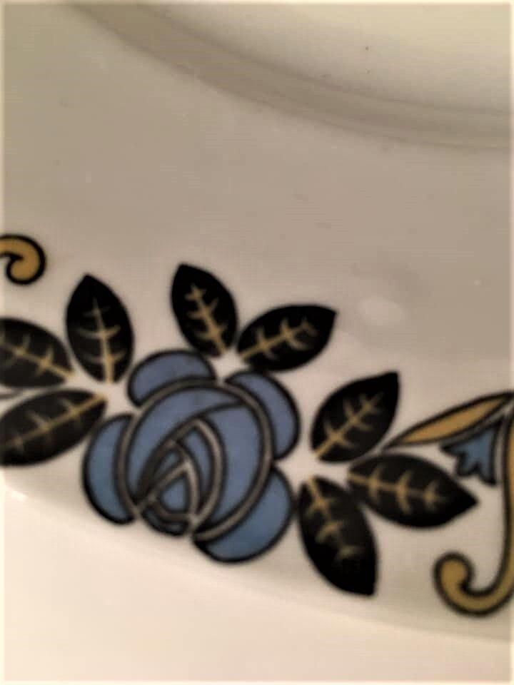 Limoges porcelain cake display with stylized floral motifs