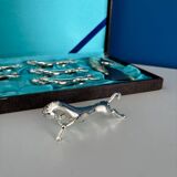 Set of 6 vintage silver metal knife holders and bottle opener, chev design