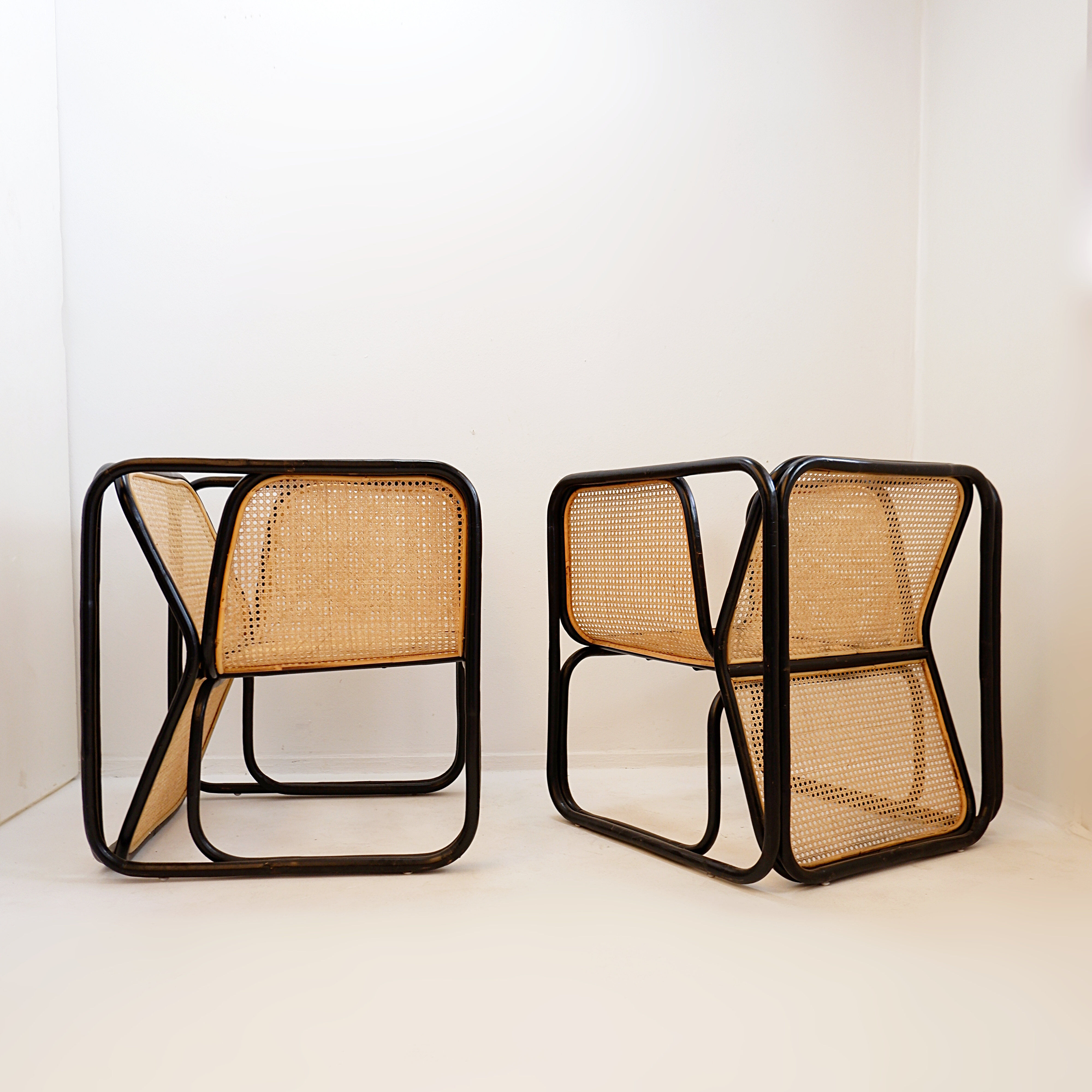 Pair of designer armchairs in curved wood and wicker