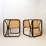 Pair of designer armchairs in curved wood and wicker