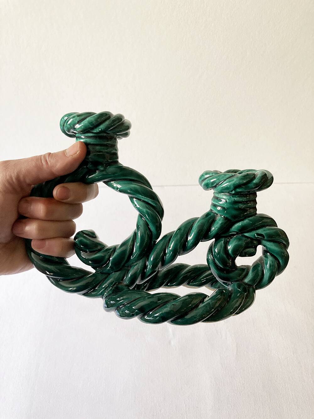Two-armed candlestick in green glazed ceramic, braided effect