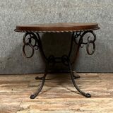 Hammered iron coffee table with circular wooden top