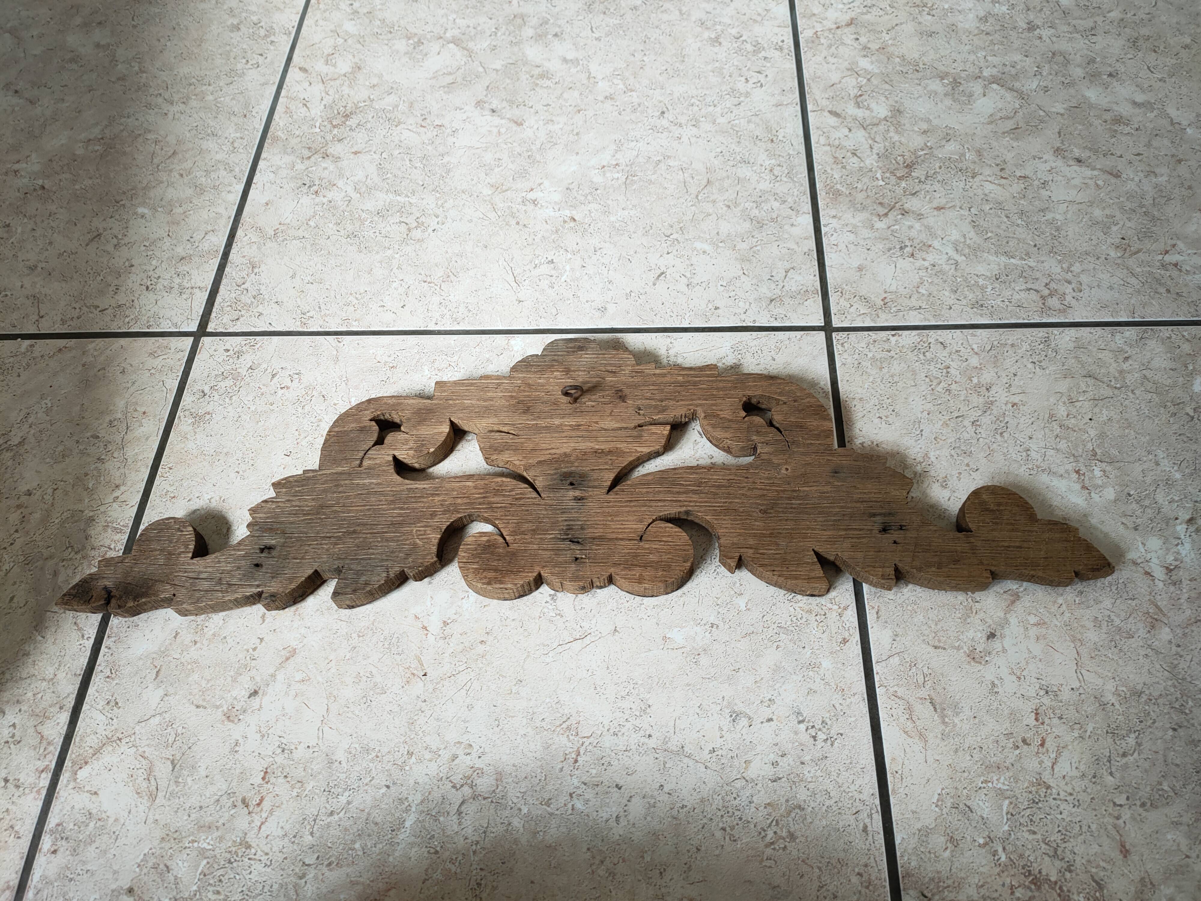 Old pediment in cut wood