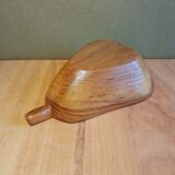 Empty wooden pocket in the shape of a vintage pear