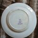 13 mismatched flat plates in ironstone
