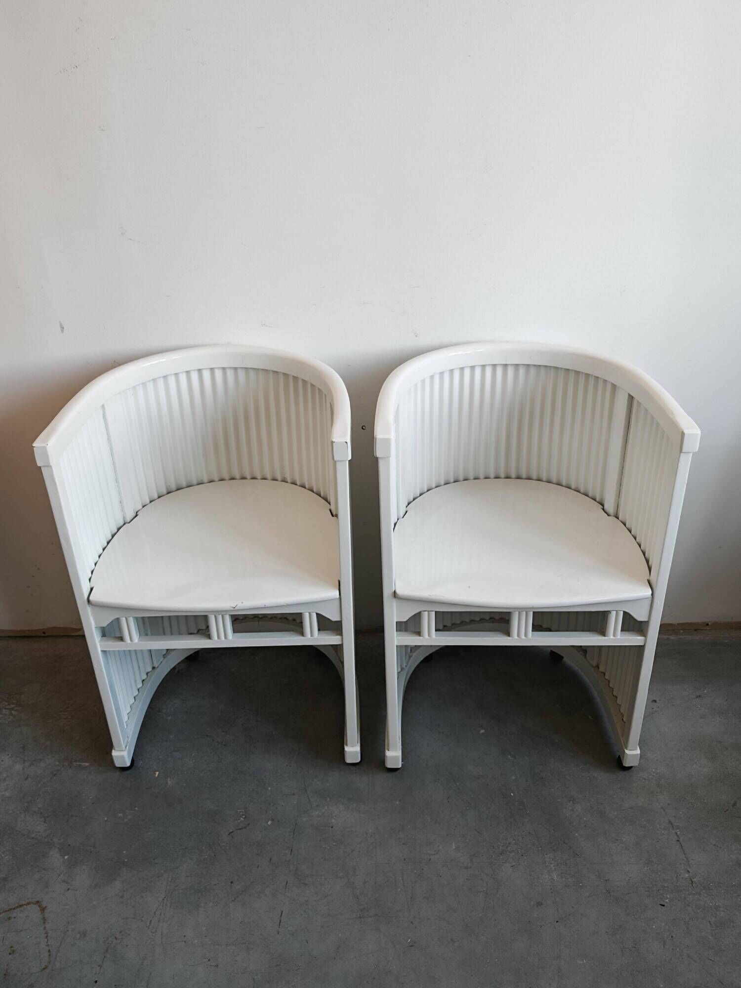 Pair of antique horseshoe accent chairs attributed to Hans Gunther Reinstein.