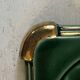 Art Deco bottle coaster in speckled green glazed ceramic and