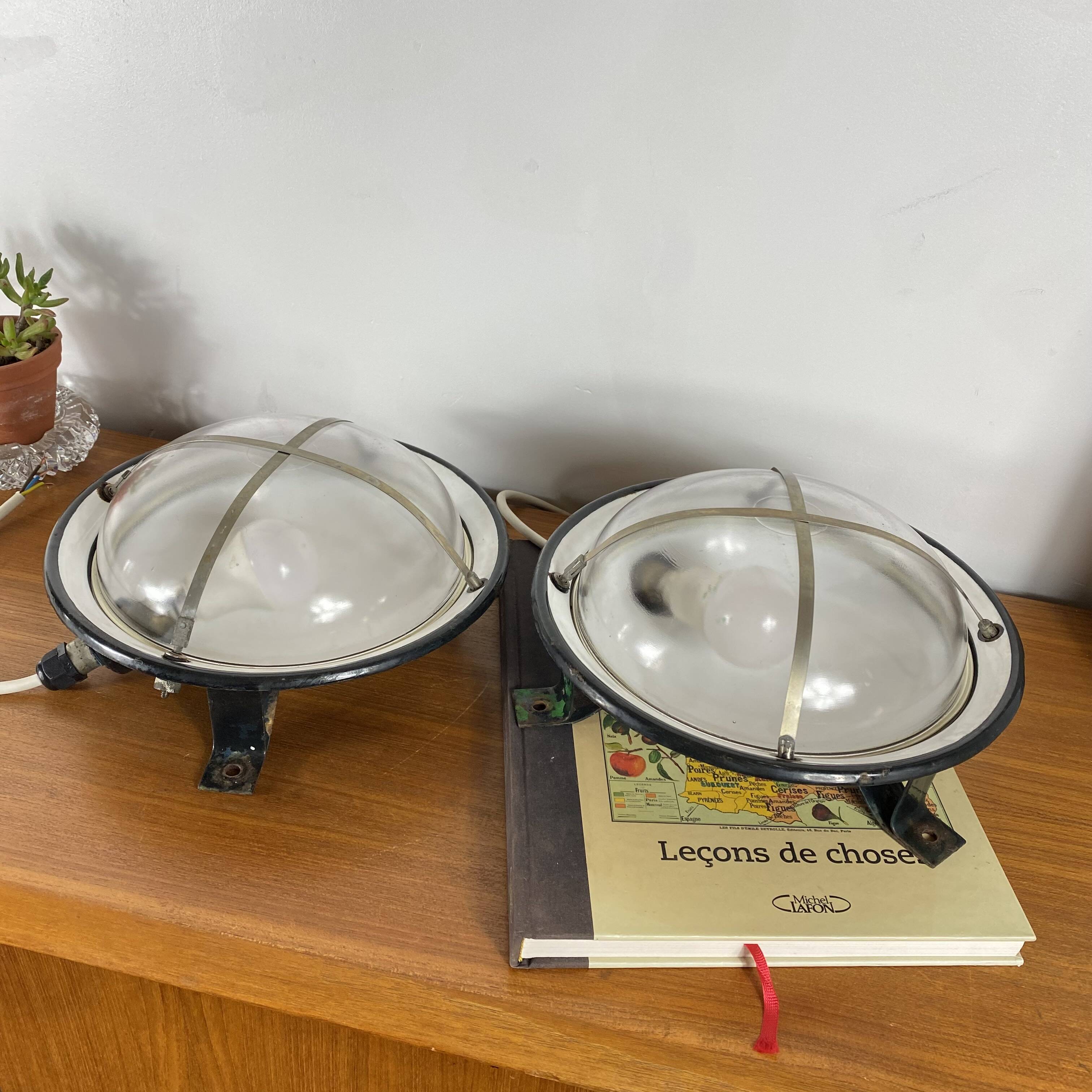 Pair of vintage industrial wall sconces or ceiling lights in enamelled sheet metal.