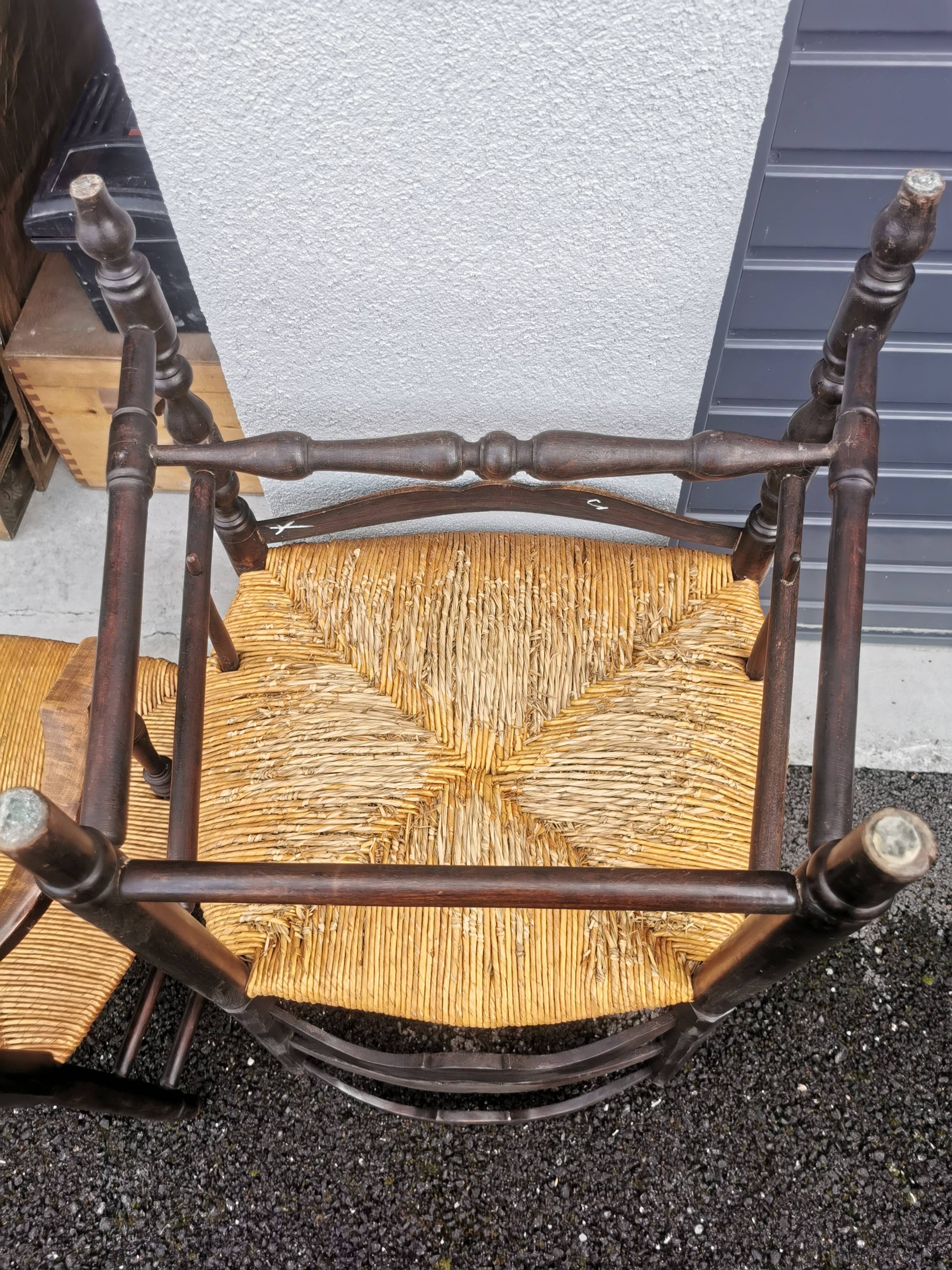 Pair of blackened wooden armchairs