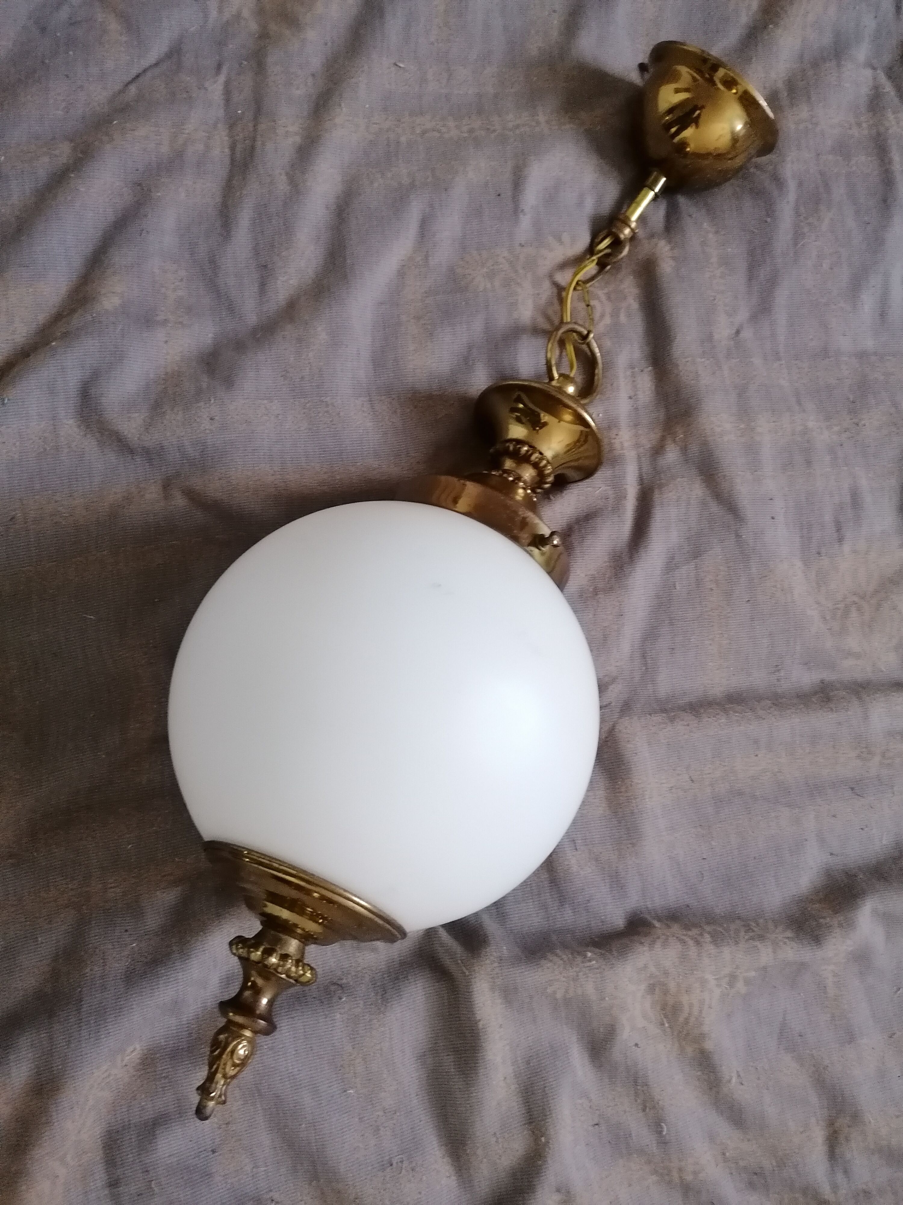 Golden metal and opaline glass globe