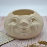 Cache pot visage
