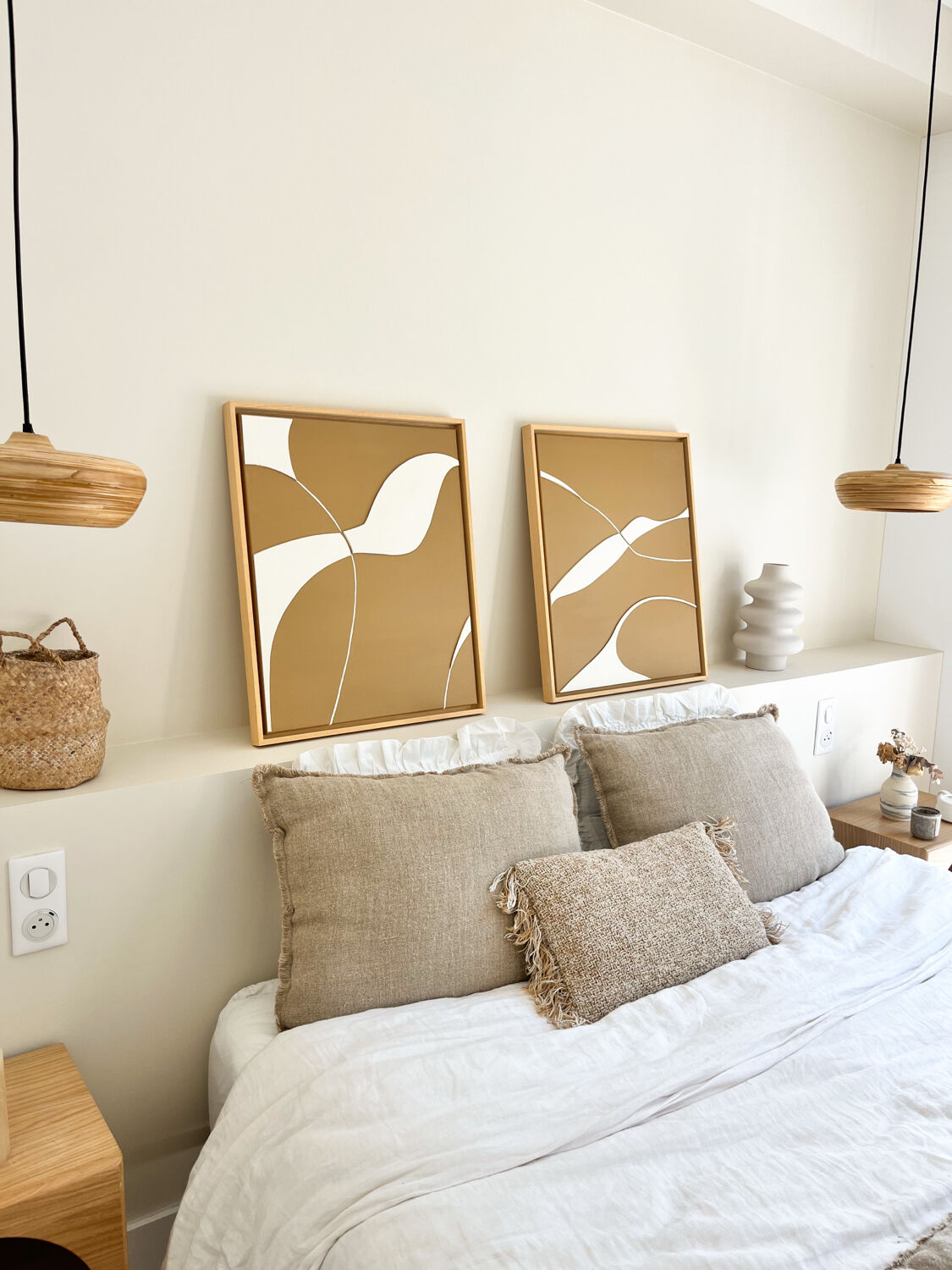 Diptych relief panels with a brown camel and cream background.