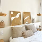 Diptych relief panels with a brown camel and cream background.