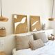 Diptych relief panels with a brown camel and cream background.