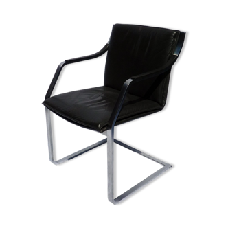 Chair with steel and leather armrests