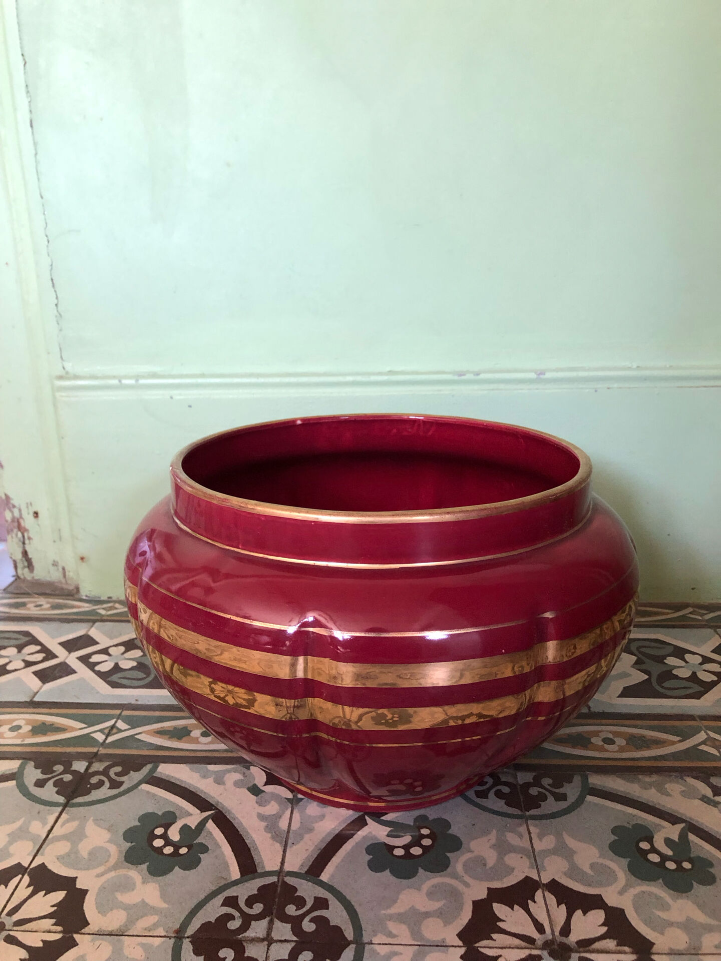 Large burgundy and gold vase