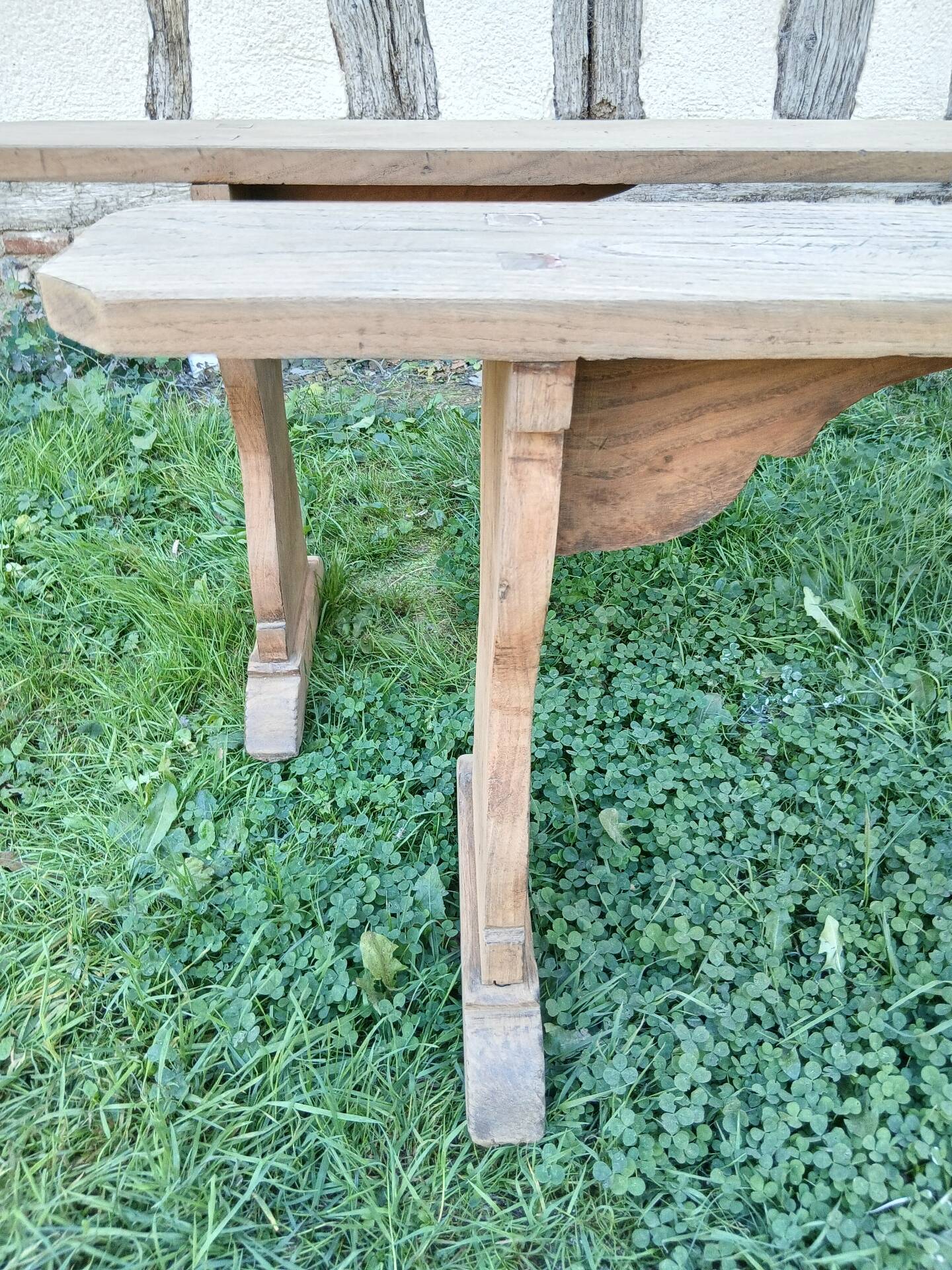 Pairs of large benches in raw fir wood.