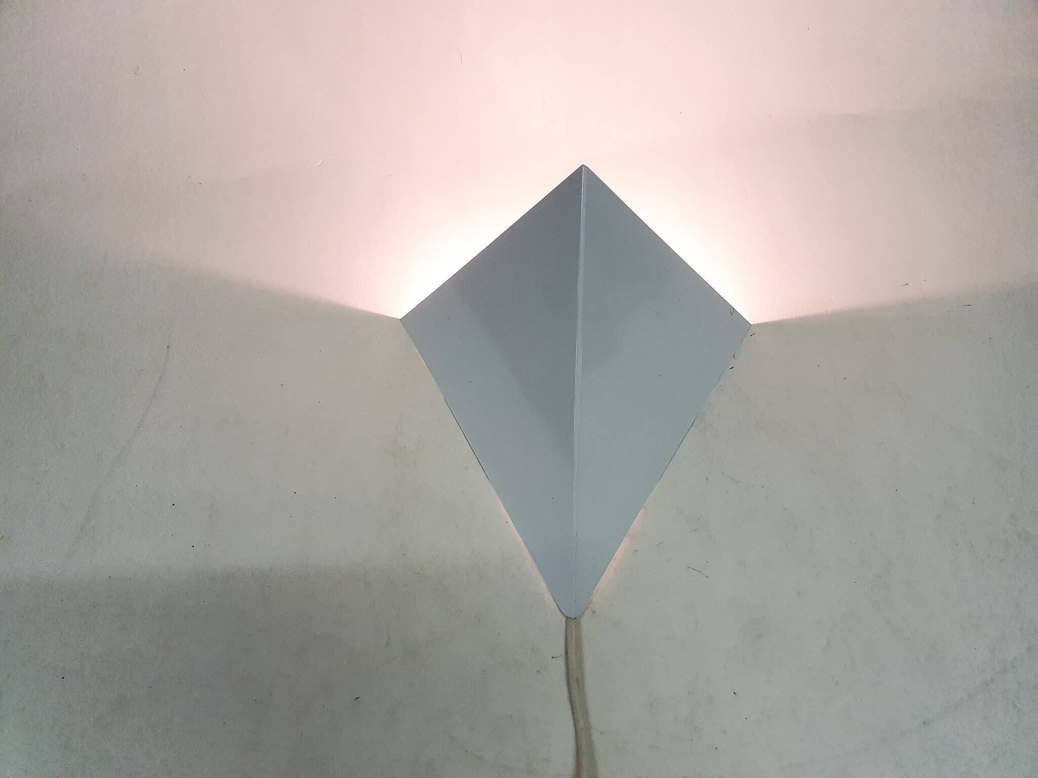 White metal wall light in good condition. By Anvia, The Netherlands.