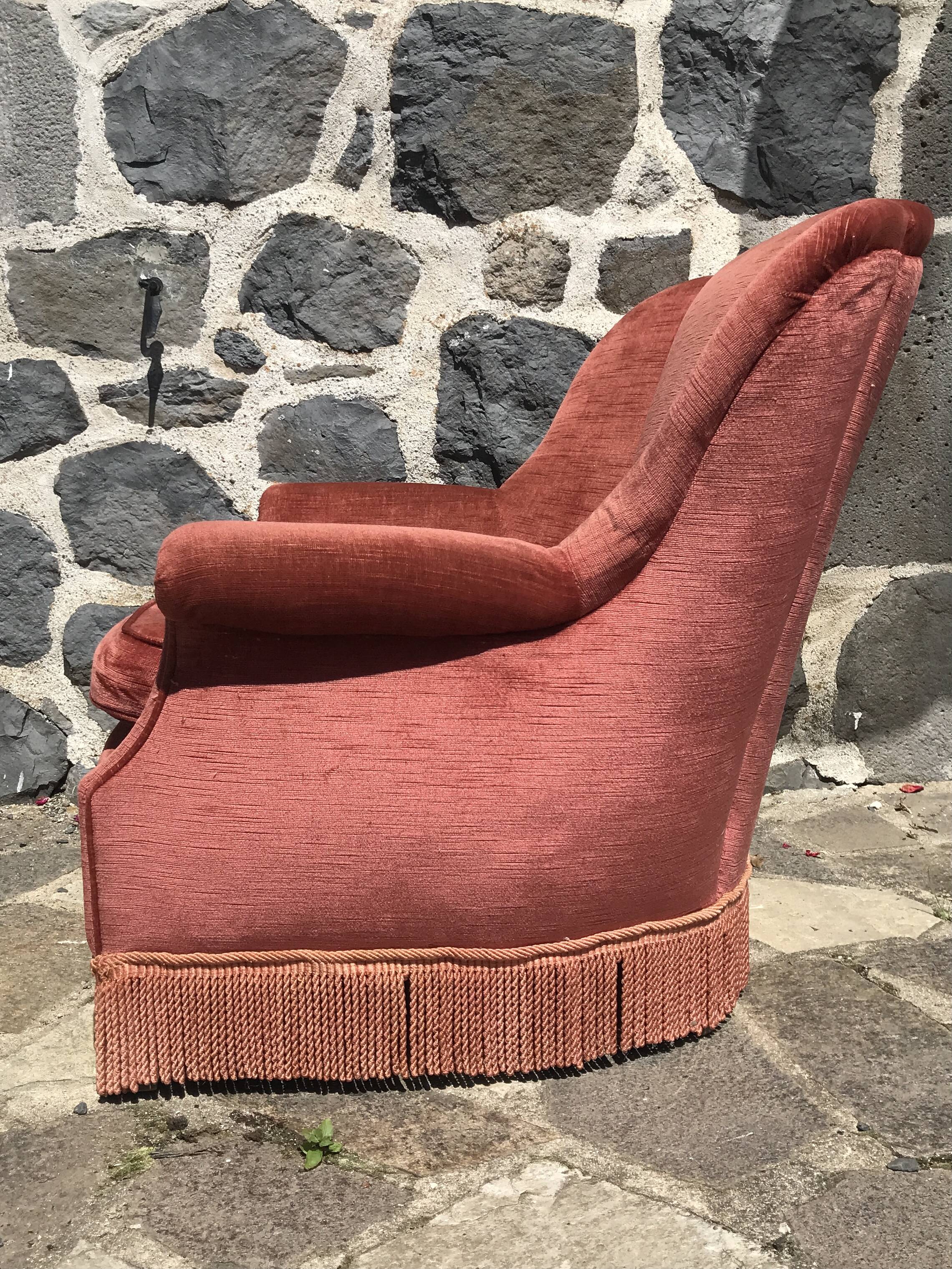 Vintage pink velvet armchair with fringes