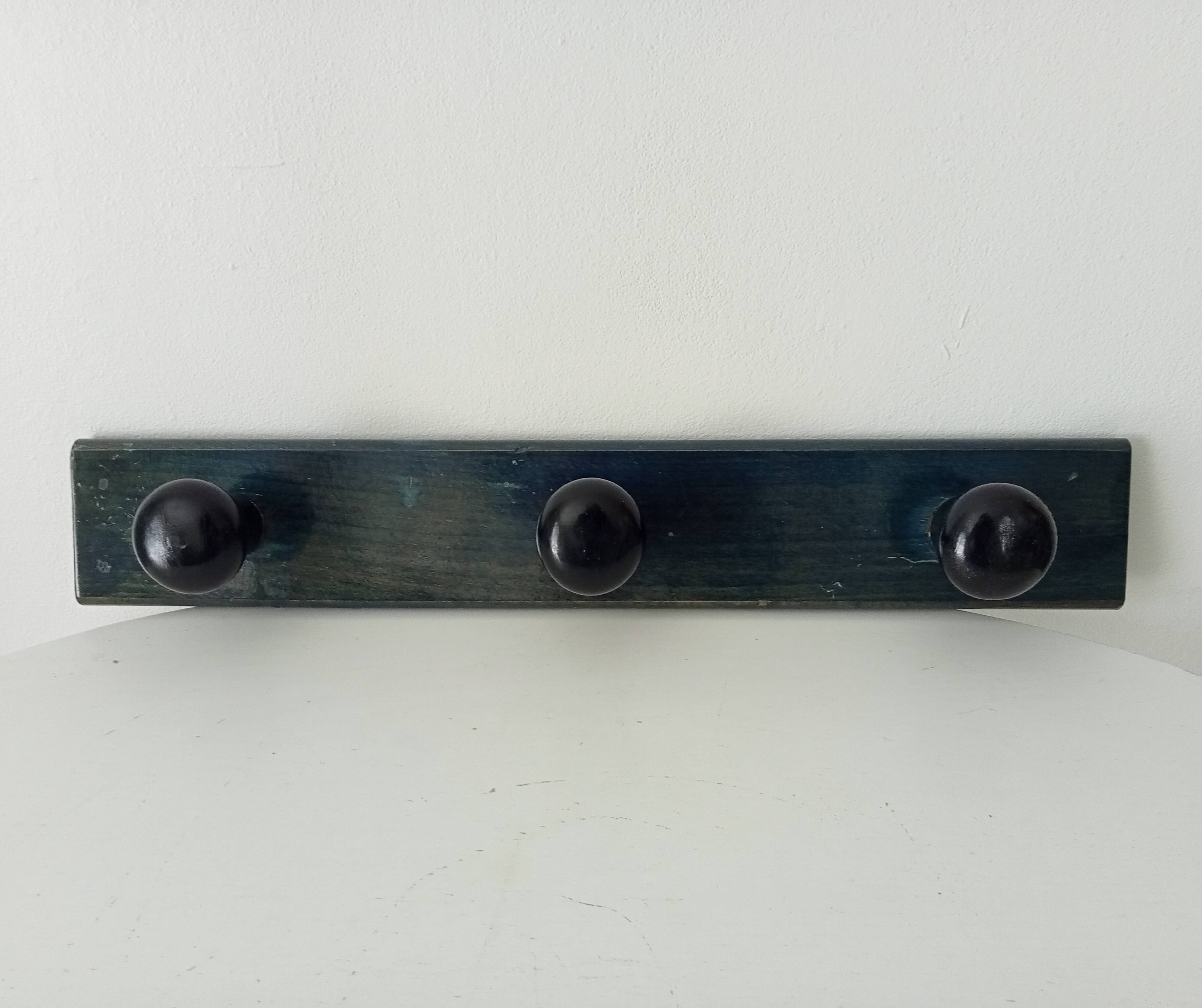 Vintage wall-mounted coat rack in lacquered wood from the 60s