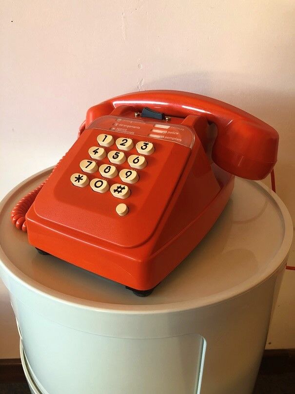 Orange Socotel phone with keys from the 70s 80s