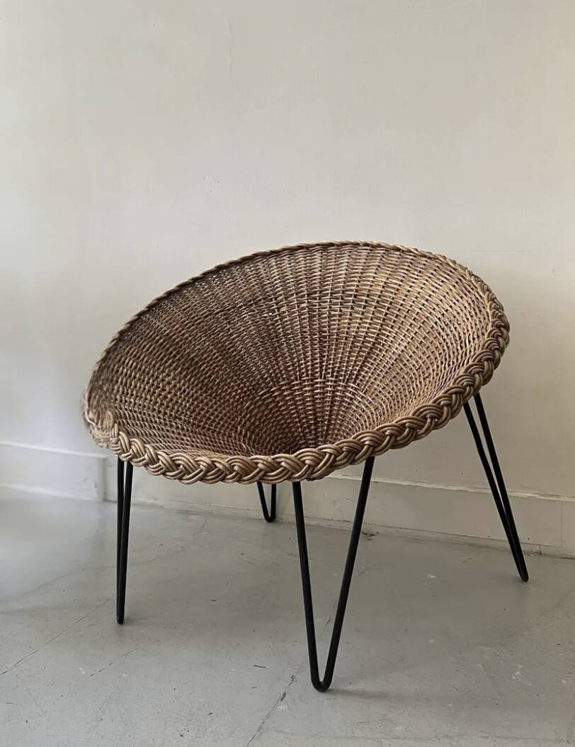 Italian basket chair in rattan and black metal, 1950s design.