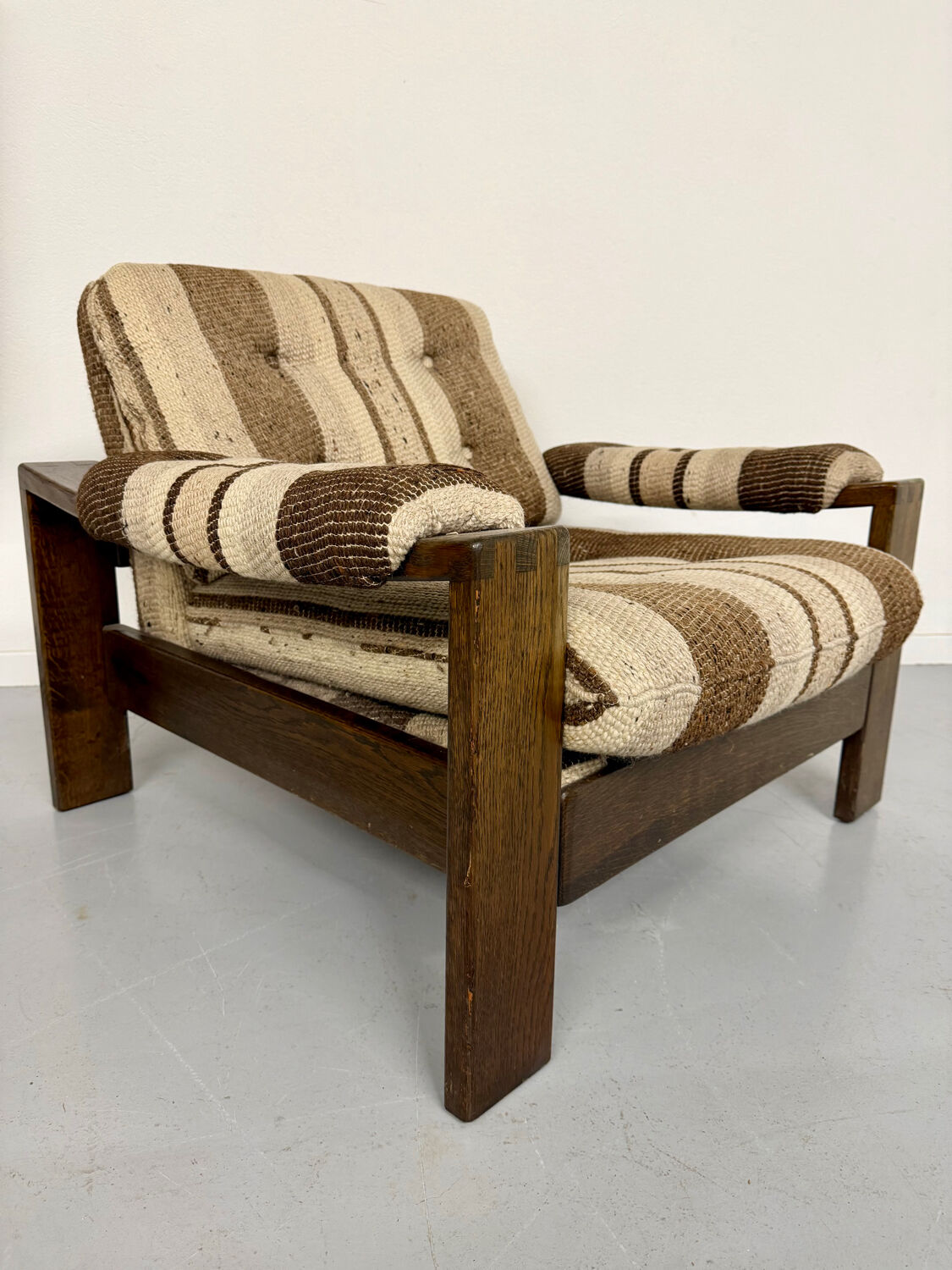 2 vintage 1970s wooden and fabric armchairs