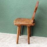 Old Swiss escabelle chair in carved wood
