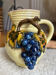 Earthenware jug/carafe HB with grape bunch slip decoration.