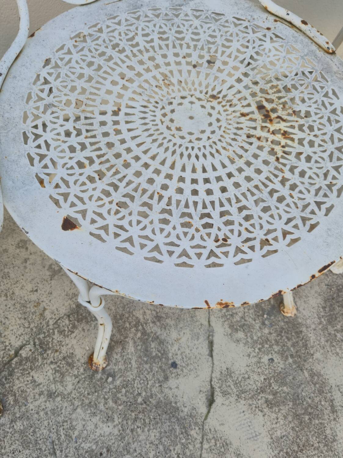Garden furniture, two armchairs and two wrought iron chairs, period 1