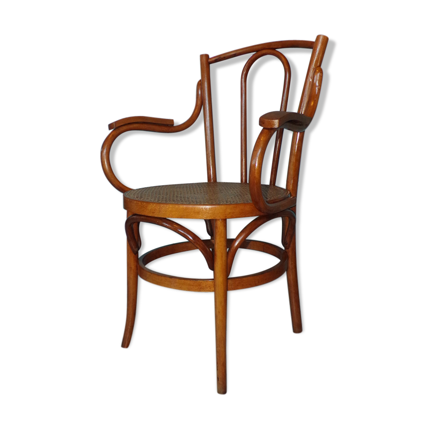 Old armchair in curved caned wood of 1900