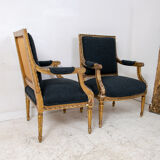 Pair of 19th century Louis XVI gilt armchairs newly re upholstered in holland and sherry fabric