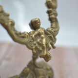 Adjustable psyche mirror of 33 centimeters in gilded bronze with angel ornament