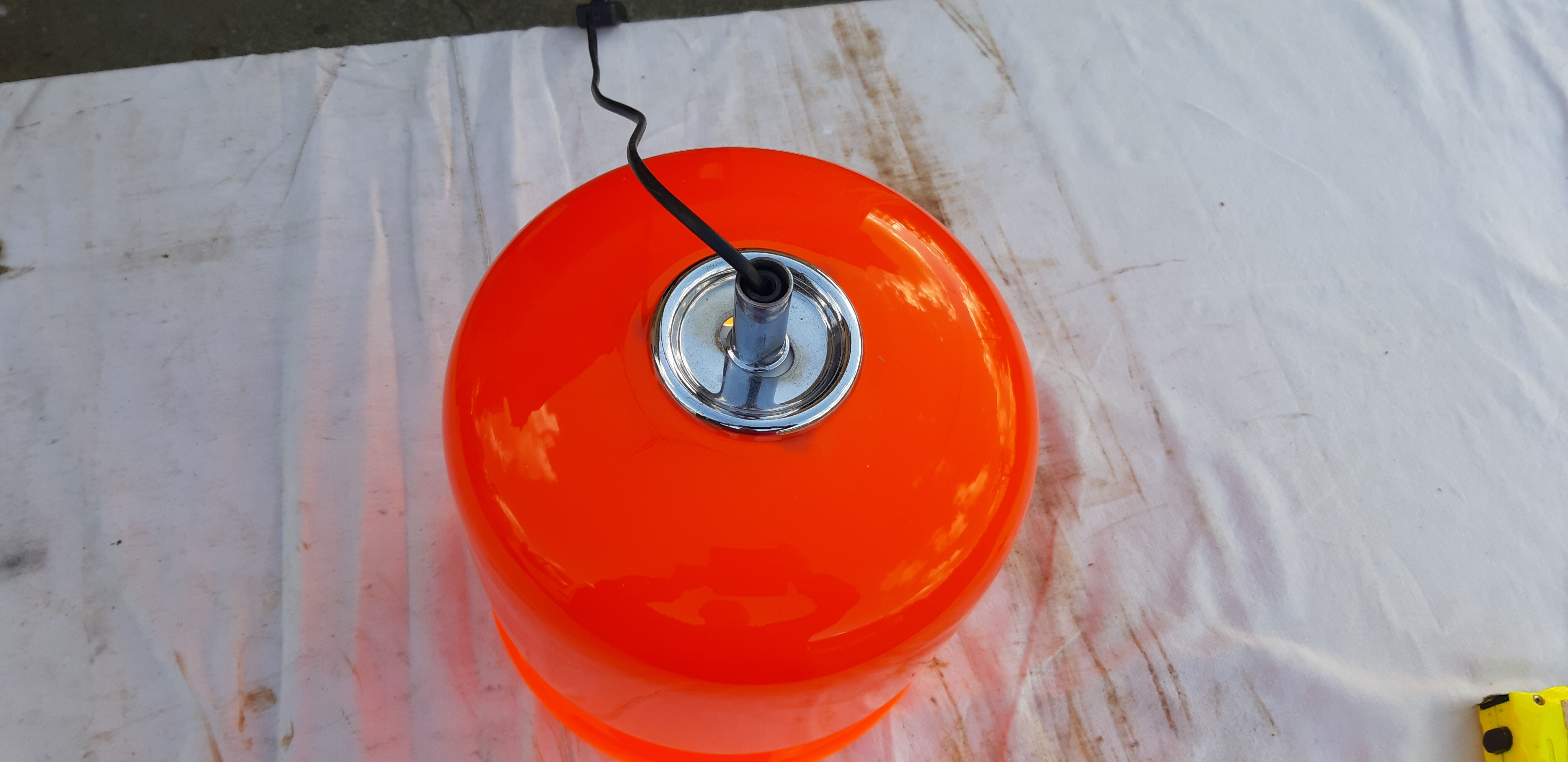 Vintage lamp of the 70s in orange opaline