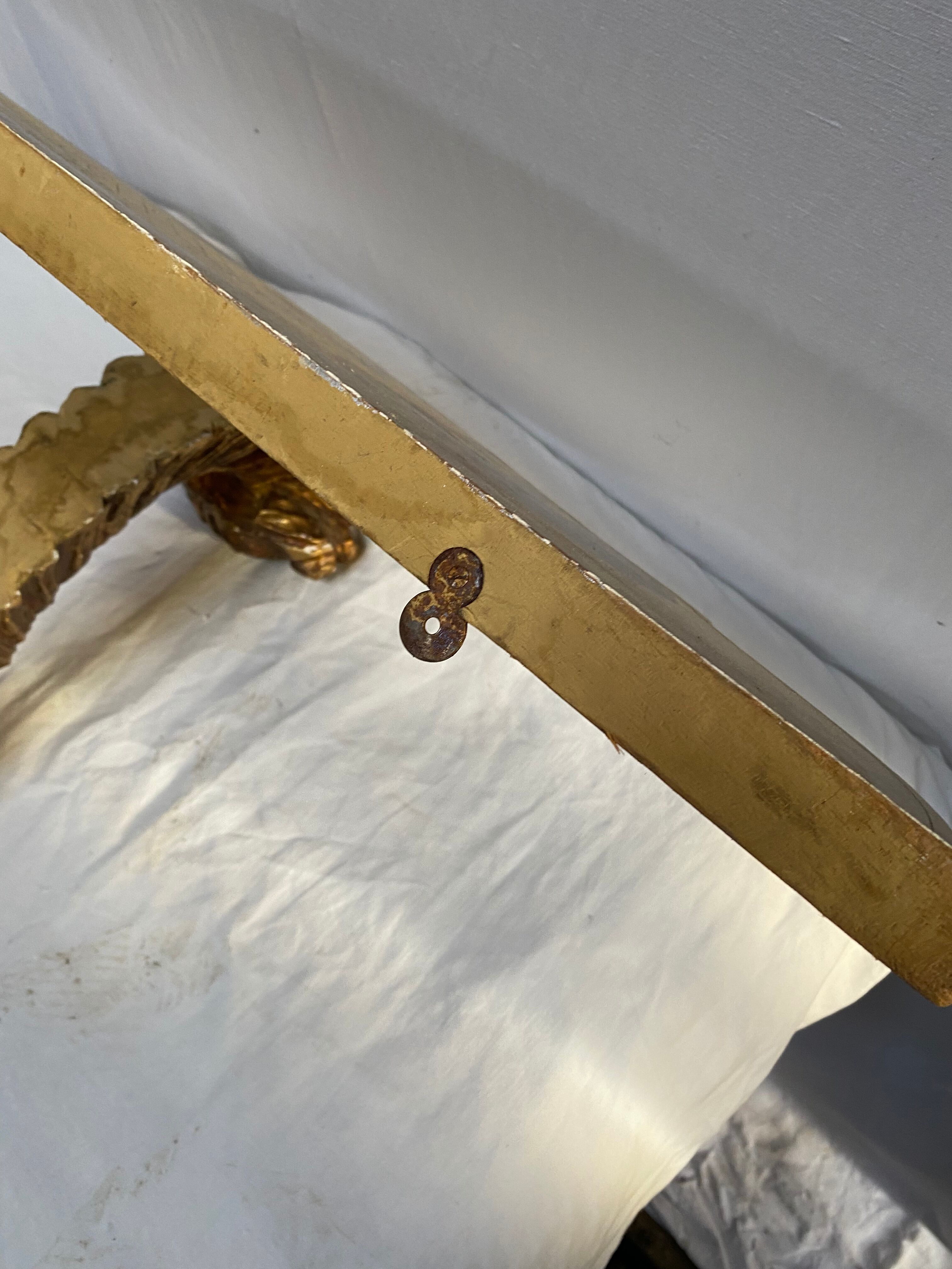 Wooden wall console and antique gilded stucco
