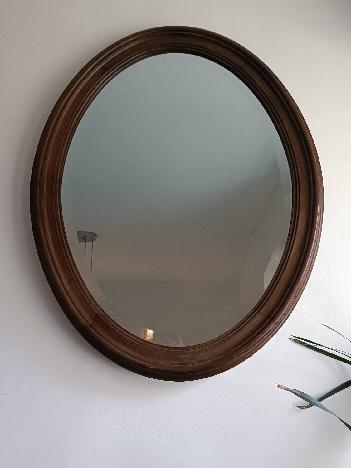 Antique oval beveled mirror
